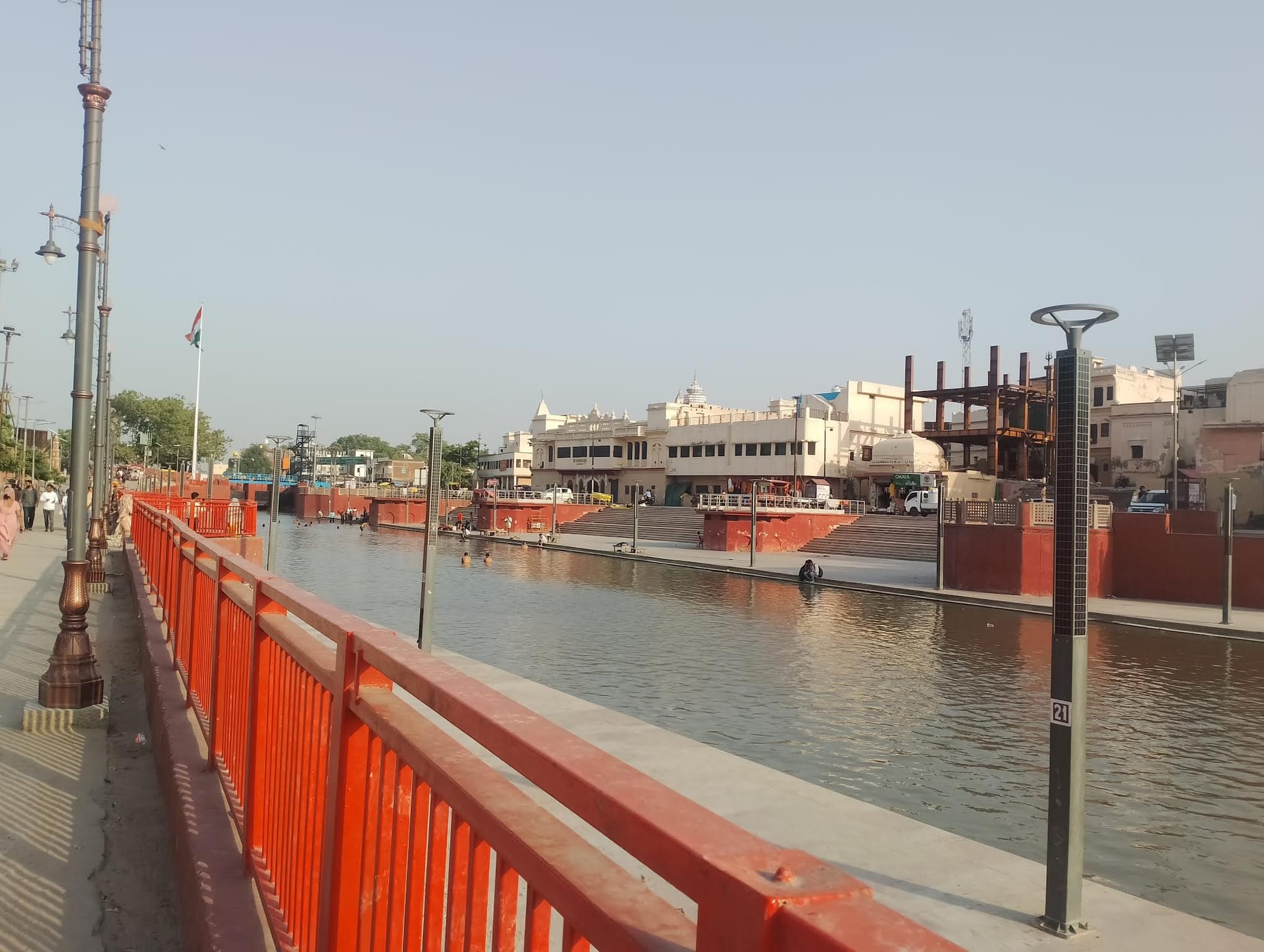 The ghats and orange-railed walkway of Ram Ki Paidi on the Saryu at Ayodhya