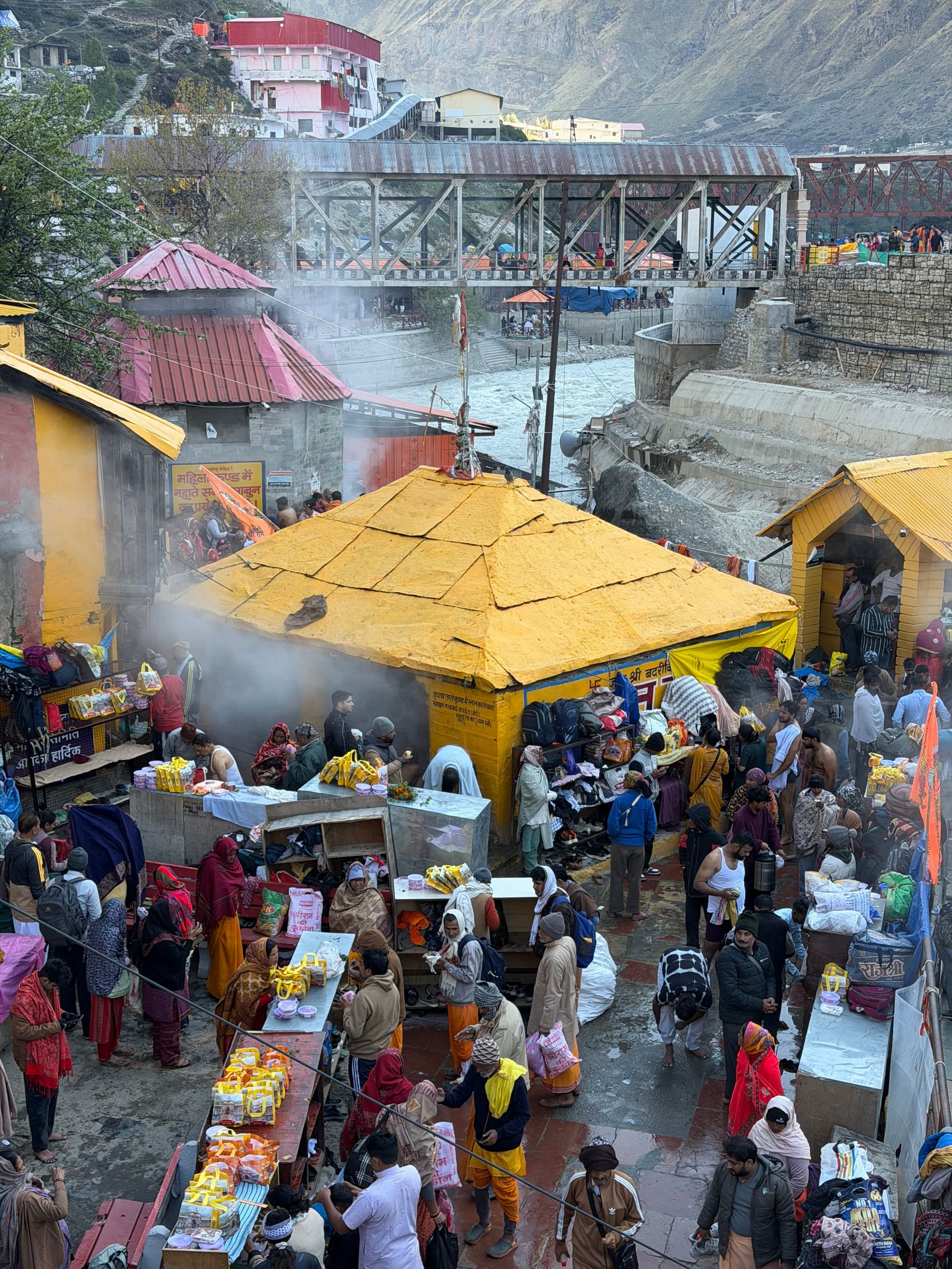 Pilgrims gathered at the steaming Tapt Kund hot springs below Badrinath Temple