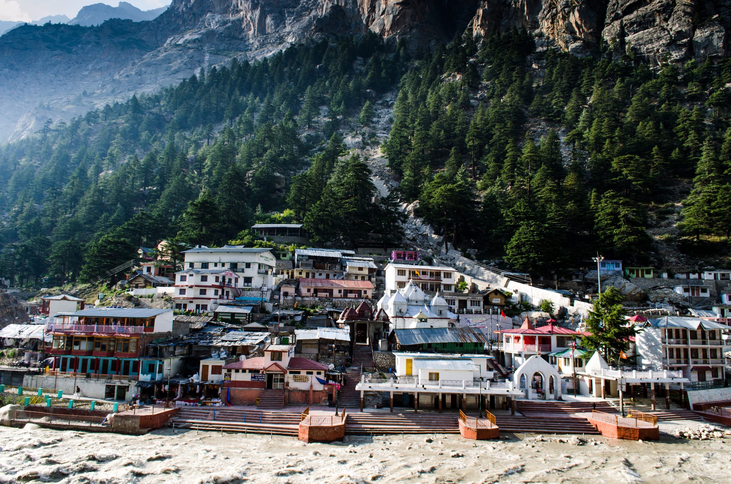 Gangotri town and its temple quarter beneath steep, pine-covered Himalayan slopes